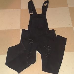 Distressed skinny overalls